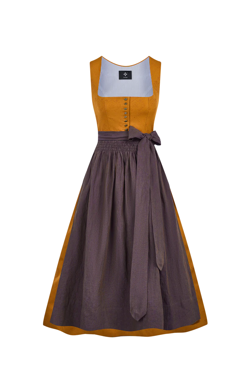 Die Faszination des Dirndls: Dunkelgrünes, rotes Samt und oranges Dirndl